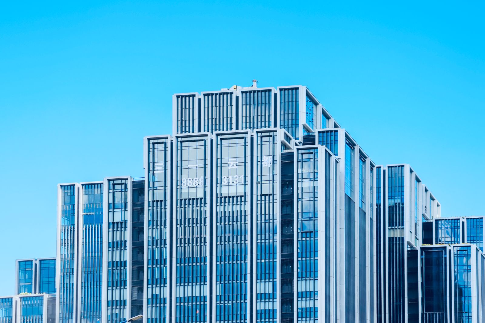 Glass office tower exterior from street level