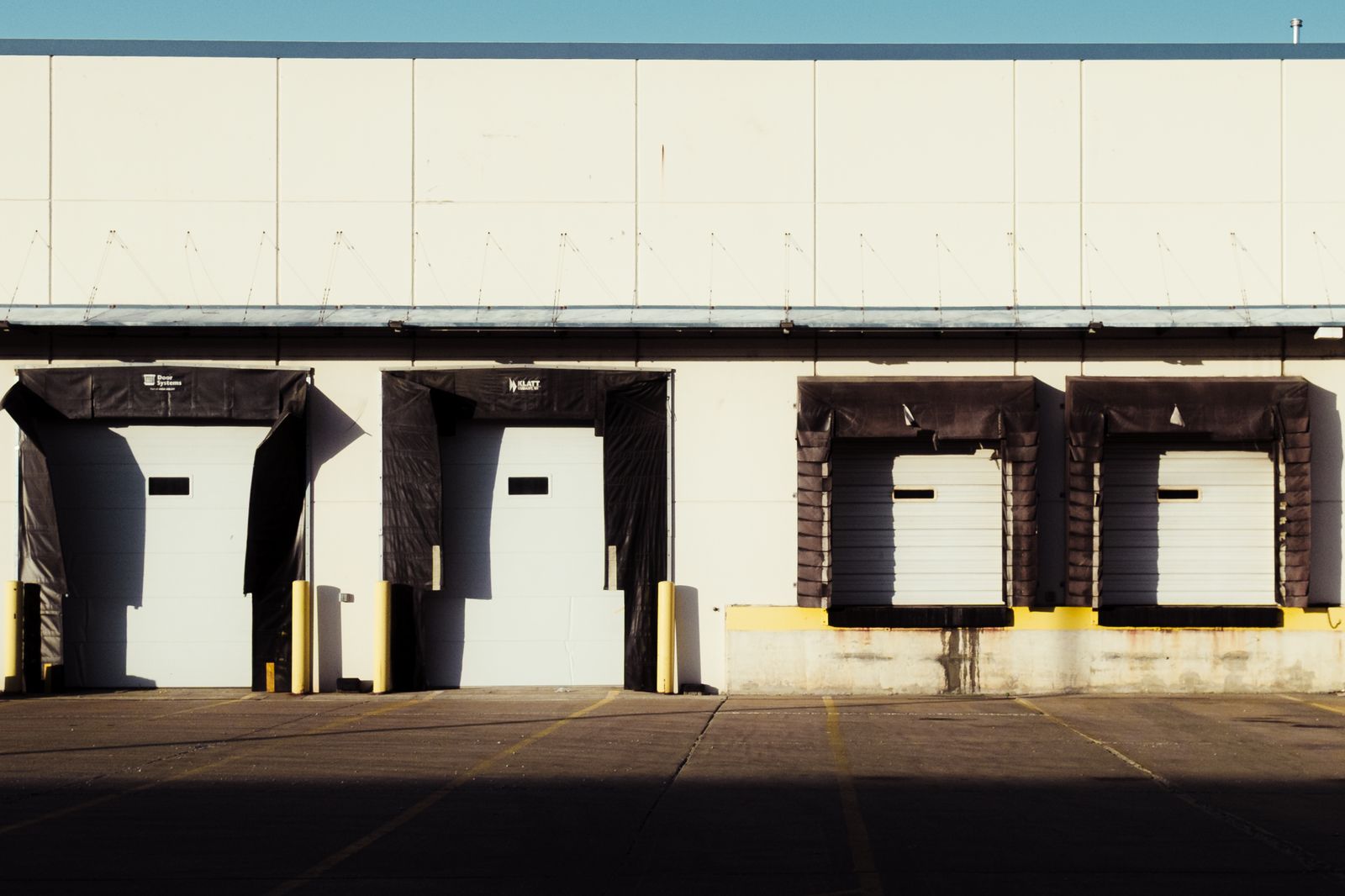 Loading dock doors along a distribution warehouse