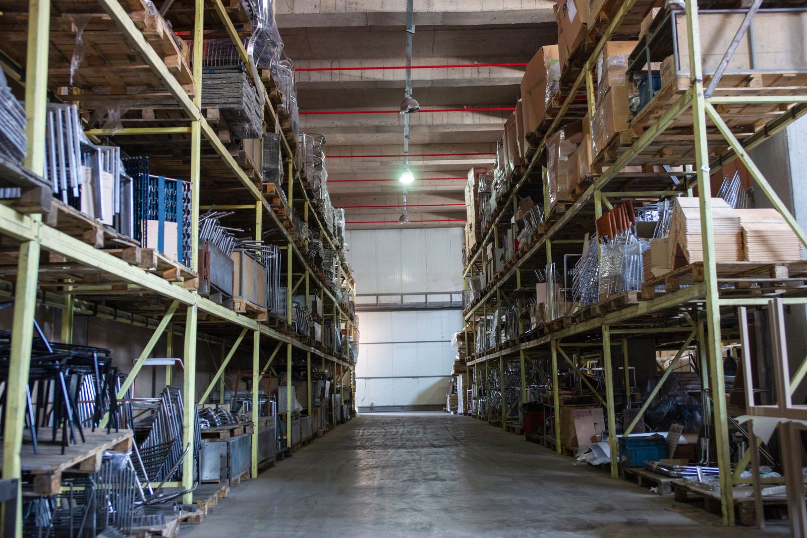 Interior of a manufacturing building with high bays and overhead lighting