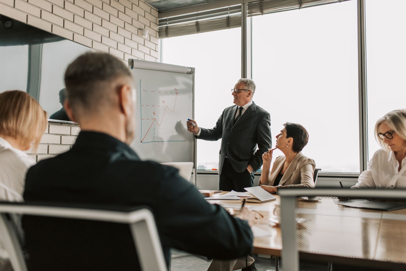 Brokerage team working together in a meeting room