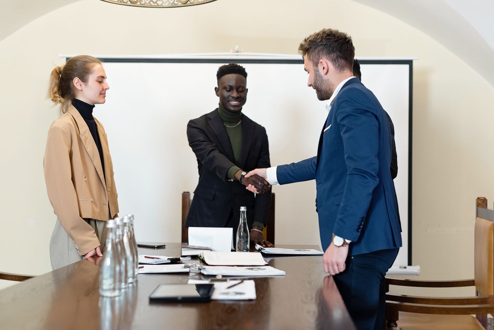 Advisors reviewing a lease across a conference table