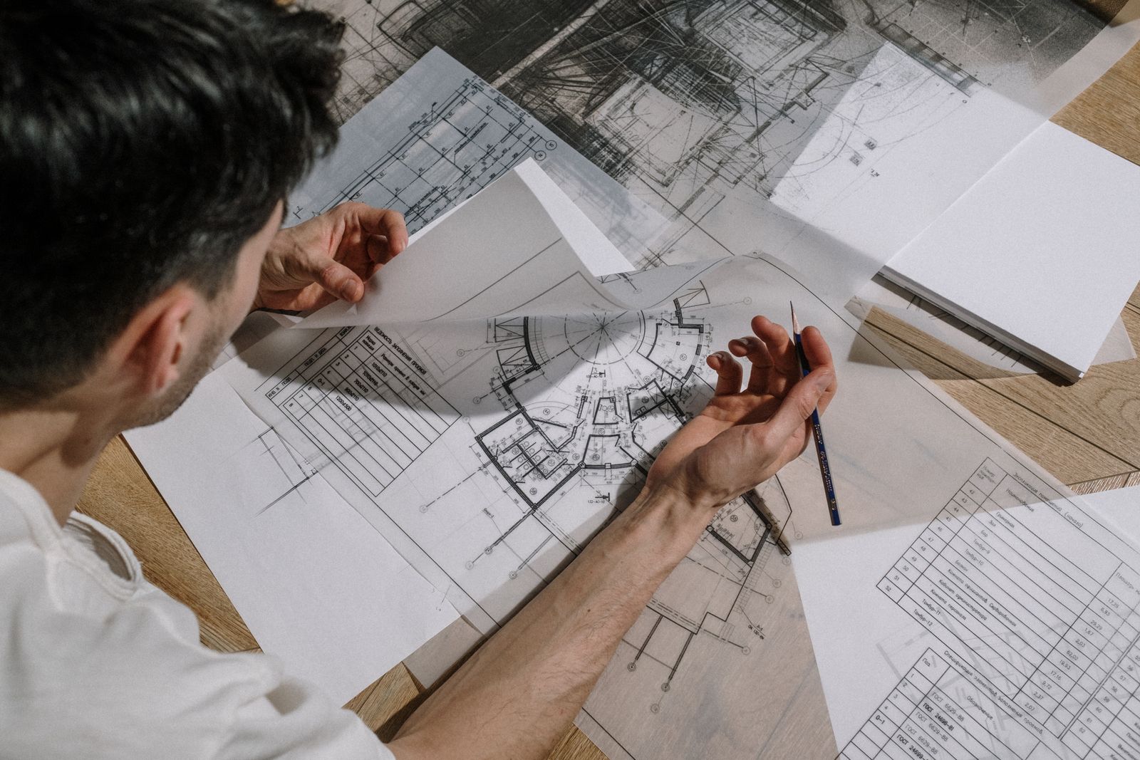 Architectural floor plans and drawings on a table