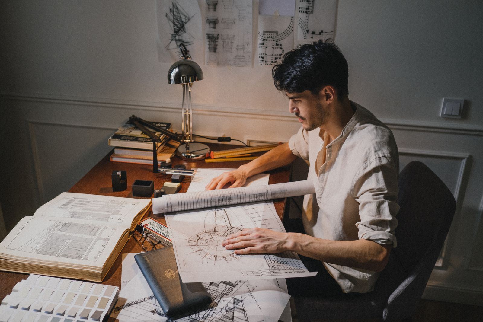 Lease documents and building plans on a desk